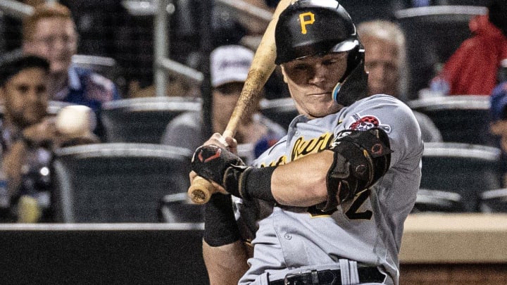 Henry Davis of the Pittsburgh Pirates leans out of the way of a pitch during a game against the Mets