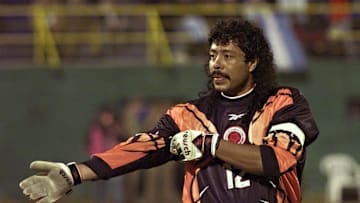 Colombian soccer player Rene Higuita adjusts his s
