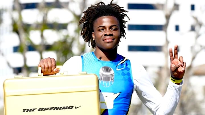 Centennial High School WR Quentin Hales hold up his offensive MVP award