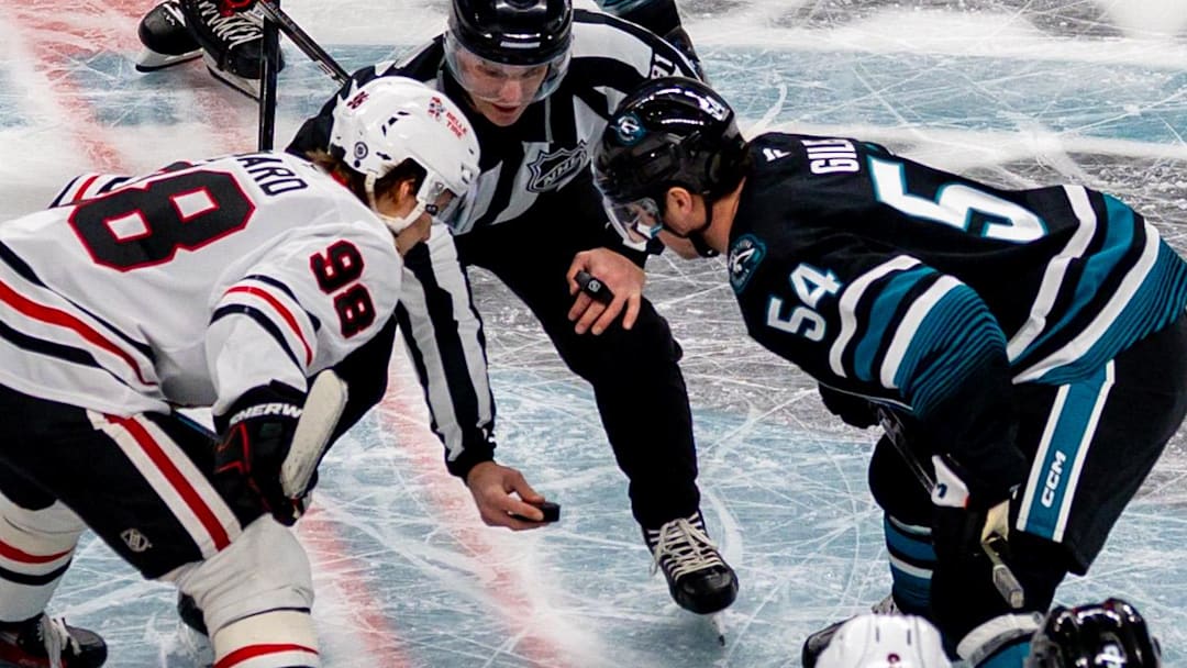 Mar 13, 2025; San Jose, California, USA; A face off between the Chicago Blackhawks and the San Jose Sharks at SAP Center at San Jose. Mandatory Credit: Bob Kupbens-Imagn Images