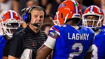 Florida coach Billy Napier talks with quarterback DJ Lagway (2) during the first half of the team's game against Central Florida at Ben Hill Griffin Stadium in Gainesville, Fla., on Saturday, October 5, 2024.