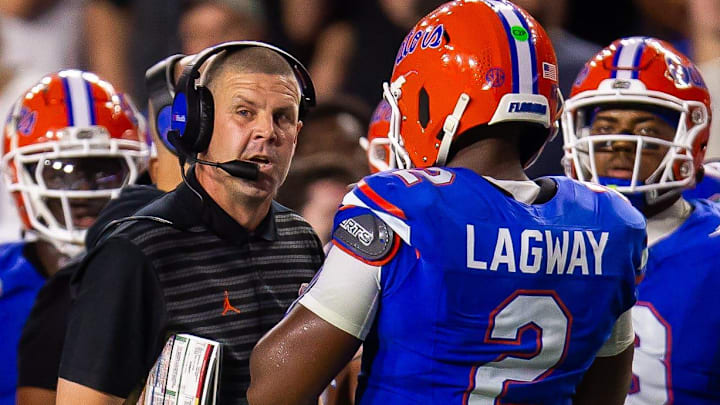 Florida coach Billy Napier talks with quarterback DJ Lagway (2) during the first half of the team's game against Central Florida at Ben Hill Griffin Stadium in Gainesville, Fla., on Saturday, October 5, 2024.