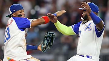 Atlanta Braves outfielder Ronald Acuna Jr. (13) and designated hitter Marcell Ozuna (20) celebrate after a victory against the Washington Nationals at Truist Park.