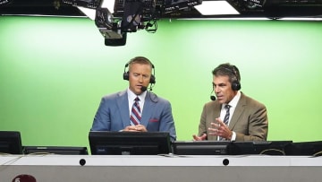 Aug 30, 2014; Arlington, TX, USA; ESPN broadcasters Kirk Herbstreit (right) and Chris Fowler announce the game with the Florida State Seminoles playing against the Oklahoma State Cowboys at AT&T Stadium. Mandatory Credit: Matthew Emmons-USA TODAY Sports