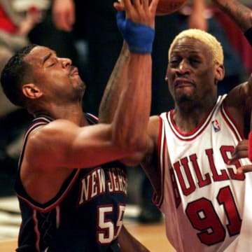 April 26, 1998; Chicago, IL, USA; Chicago's Dennis Rodman (91), middle, charges to the basket between New Jersey's Jayson Williams (55), left, and Kendall Gill (13), right. Mandatory Credit: Anne Ryan-USA TODAY Sports
