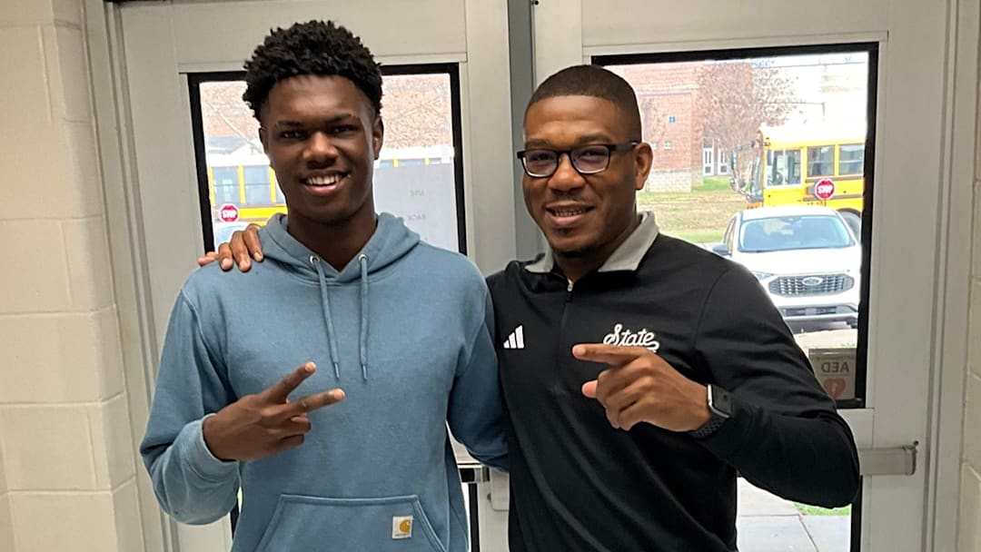 Ridgeland (Miss.) safety Trae Collins with Mississippi State assistant coach Kevie Thompson.