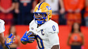 Oct 18, 2025; Syracuse, New York, USA; Pittsburgh Panthers running back Desmond Reid (0) runs with the ball as Syracuse Orange defensive back Demetres Samuel Jr. (1) defends during the first half at the JMA Wireless Dome. Mandatory Credit: Rich Barnes-Imagn Images