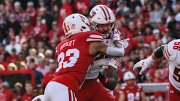 Javin Wright  makes a tackle on a Wisconsin runner. 