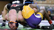 Ariah Mills (right) of Athens Christian remains the top-ranked wrestler in the nation, in the 106-pound division on Saturday.