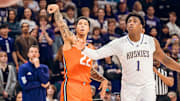 Illinois swingman Tre White (22) follows through on a jumper in the Illini's 81-77 win over Washington on Sunday at Alaska Airlines Arena in Seattle.