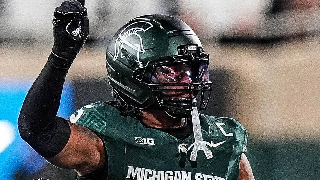 Michigan State linebacker Jordan Hall celebrates a tackle against Michigan wide receiver Semaj Morgan during the first half at Spartan Stadium in East Lansing on Saturday, October 25, 2025.