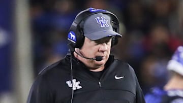 Kentucky head coach Mark Stoops walks the field during a time out as his special teams practice snapping the ball for extra point attempts at Kroger Field Saturday, Oct. 12, 2024 in Lexington, Ky.