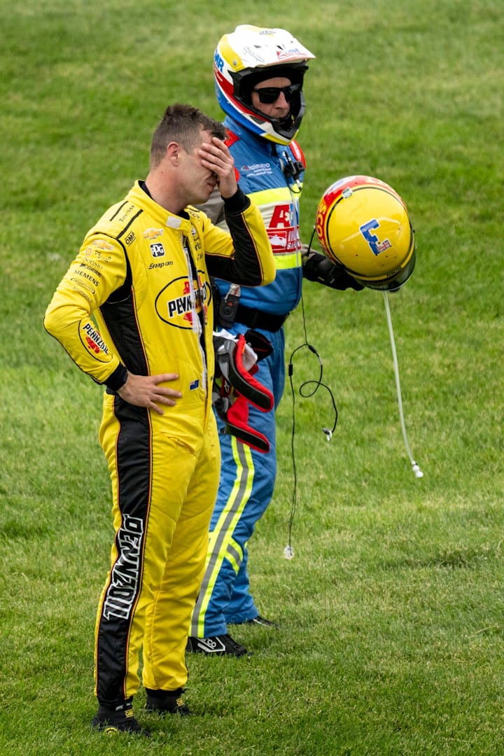 Team Penske driver Scott McLaughlin reacts after spinning out in the first turn on a pace lap during the Indianapolis 500. 