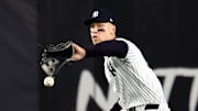 Oct 30, 2024; New York, New York, USA; New York Yankees outfielder Aaron Judge (99) makes a fielding error during the fifth inning against the Los Angeles Dodgers in game five of the 2024 MLB World Series at Yankee Stadium. Mandatory Credit: Vincent Carchietta-Imagn Images