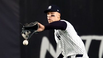Oct 30, 2024; New York, New York, USA; New York Yankees outfielder Aaron Judge (99) makes a fielding error during the fifth inning against the Los Angeles Dodgers in game five of the 2024 MLB World Series at Yankee Stadium. Mandatory Credit: Vincent Carchietta-Imagn Images