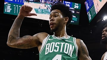 Oct 22, 2025; Boston, Massachusetts, USA; Philadelphia 76ers center Joel Embiid (21) and Boston Celtics guard Anfernee Simons (4) point different directions as they think the ball belongs to them during the second quarter at TD Garden. Mandatory Credit: Winslow Townson-Imagn Images