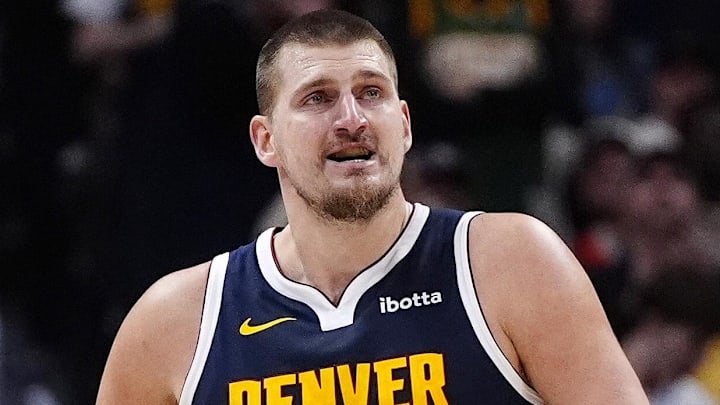 Dec 15, 2025; Denver, Colorado, USA; Denver Nuggets center Nikola Jokic (15) reacts after a three point basket in the fourth quarter against the Houston Rockets  at Ball Arena. Mandatory Credit: Ron Chenoy-Imagn Images
