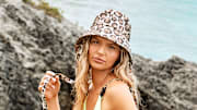Ellie Thumann was photographed by Ben Watts in Bermuda. Hat by Eugenia Kim.