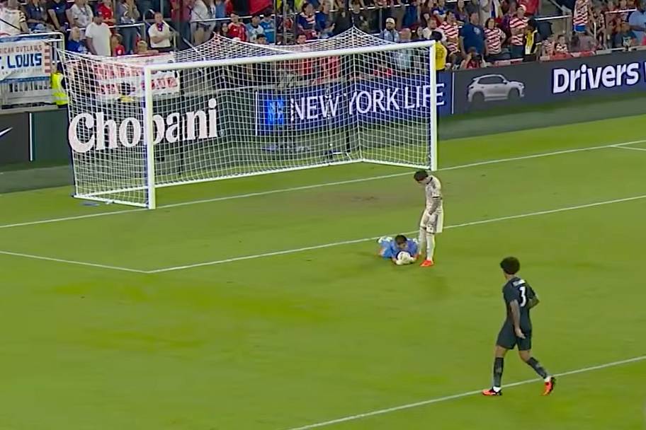 Chile’s Leandro Hernández kicking goalkeeper Brian Schwake.