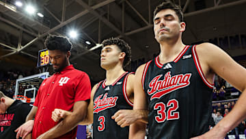 Indiana's Trey Galloway (right), Anthony Leal (middle) and Dallas James (left) during the national anthem at Alaska Airlines Arena.