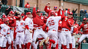 The Husker dugout celebrates Tyler Stone's (55) solo home run in the second inning.