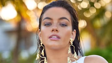 Sixtine was photographed by Derek Kettela in Belize. Swimsuit by ANTONINIAS. Earrings by Alexis Bittar.