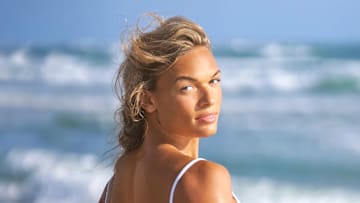 Anna Hall was photographed by Ben Horton at The Boca Raton. Swimsuit by Andi Bagus.