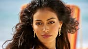 Cindy Kimberly was photographed by Ben Watts in Barbados. Swimsuit by Andi Bagus. Earrings by En Route Jewelry.