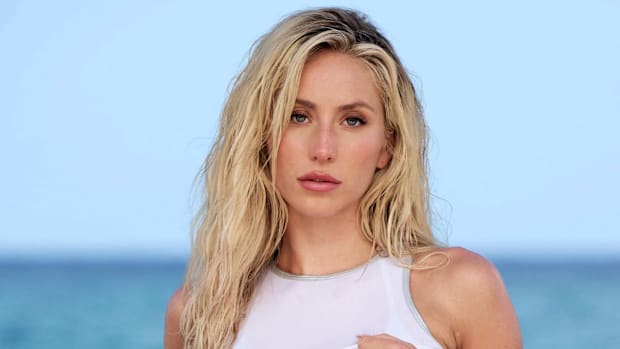 Alix Earle poses in a silver string bikini and white tank top in Florida for SI Swimsuit.