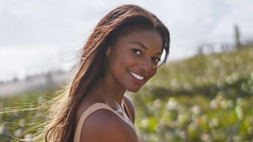 Gabby Thomas was photographed by Ben Horton at The Boca Raton. Swimsuit by HAUS OF PINKLEMONAID.