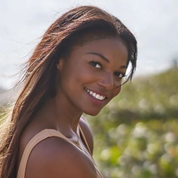 Gabby Thomas was photographed by Ben Horton at The Boca Raton. Swimsuit by HAUS OF PINKLEMONAID.