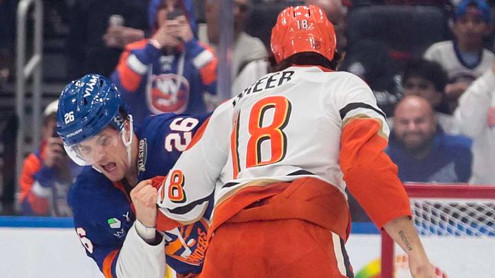 Oct 20, 2026; Elmont, New York, USA;  New York Islanders right wing Mitchell Chaffee (26) fights with Anaheim Ducks left wing A.J. Greer (18) in the second period at UBS Arena. Mandatory Credit: Wendell Cruz-Imagn Images