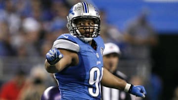 Dec 14, 2014; Detroit, MI, USA; Detroit Lions defensive tackle Ndamukong Suh (90) looks back during the fourth quarter against the Minnesota Vikings at Ford Field. Lions win 16-14. Mandatory Credit: Raj Mehta-Imagn Images