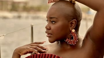 Achieng Agutu was photographed by Yu Tsai in Mexico. Swimsuit by Andrea Iyamah. Bracelets by Alexis Bittar. Earrings by JOHANNA ORTIZ VACATION. 