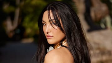 Yumi Nu was photographed by Derek Kettela in Belize. Swimsuit by MESHKI. Necklace by Alexis Bittar.