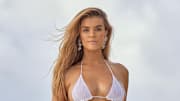 Nina Agdal was photographed by Derek Kettela in Belize. Swimsuit by Gabriela Pires Beachwear. Earrings by Monies