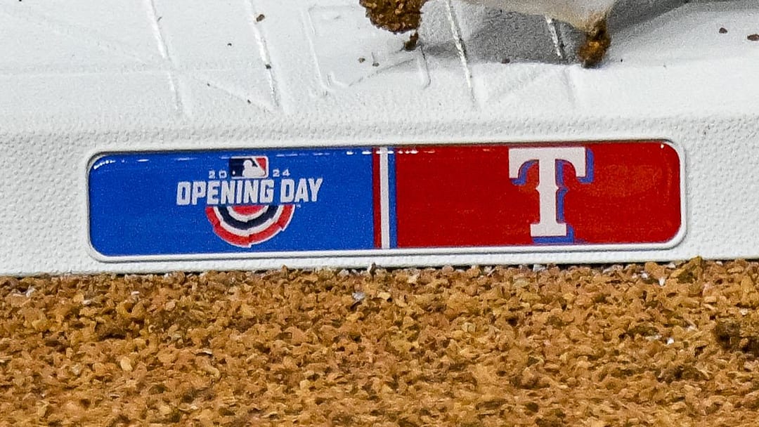 A view of third base and the Texas Rangers logo and Opening Day logo.