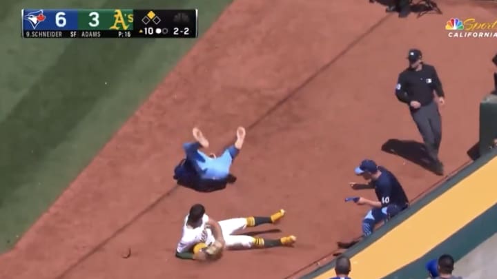 Toronto Blue Jays pitcher Yusei Kikuchi collides with Oakland Athletics first baseman Tyler Soderstrom in foul territory. 