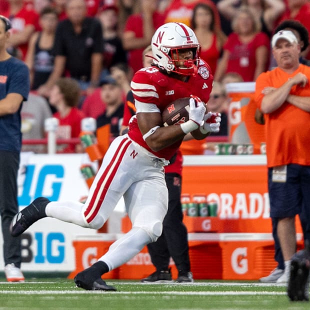 Nebraska running back Dante Dowdell rushes for a short gain against Illinois.