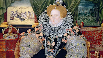 A detail of a portrait of Queen Elizabeth I painted to commemorate the defeat of the Spanish Armada (depicted in the background).