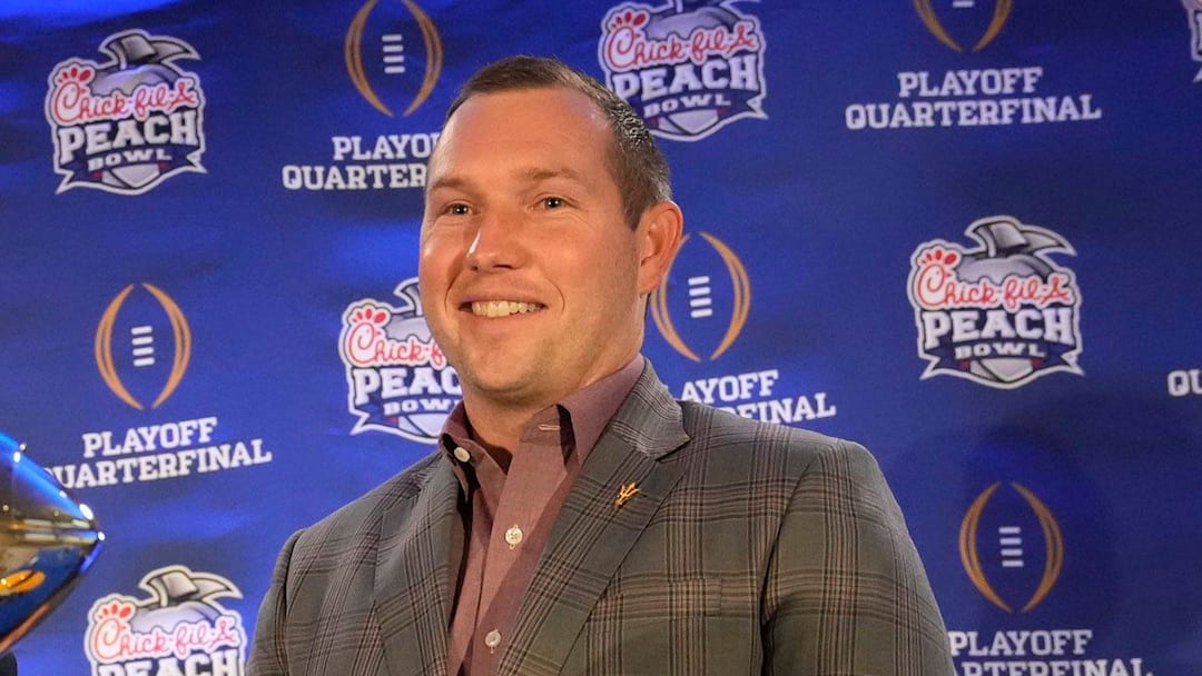Texas head coach Steve Sarkisian and Arizona State head coach Kenny Dillingham pose for photos before facing off in the Chick-fil-A Peach Bowl.