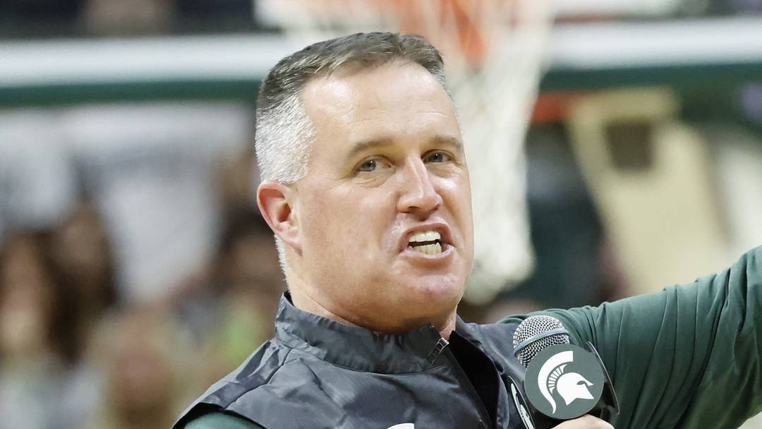 Michigan State Spartans head football coach Pat Fitzgerald points while introducing himself to the crowd at a men's basketball game against the Iowa Hawkeyes on Tuesday, Dec. 2, 2025. Fitzgerald was officially hired by MSU on Monday.