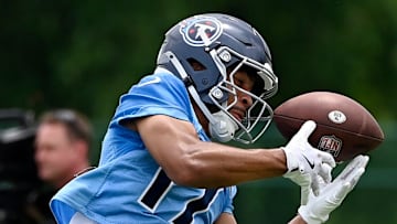 Tennessee Titans wide receiver Chimere Dike (17) pulls in a pass during an NFL football minicamp camp practice at Ascension Saint Thomas Sports Park Thursday, June 12, 2025, in Nashville, Tenn.