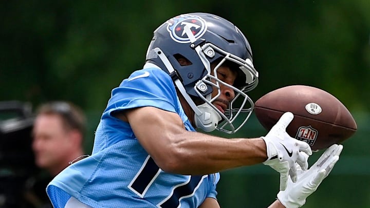 Tennessee Titans wide receiver Chimere Dike (17) pulls in a pass during an NFL football minicamp camp practice at Ascension Saint Thomas Sports Park Thursday, June 12, 2025, in Nashville, Tenn.