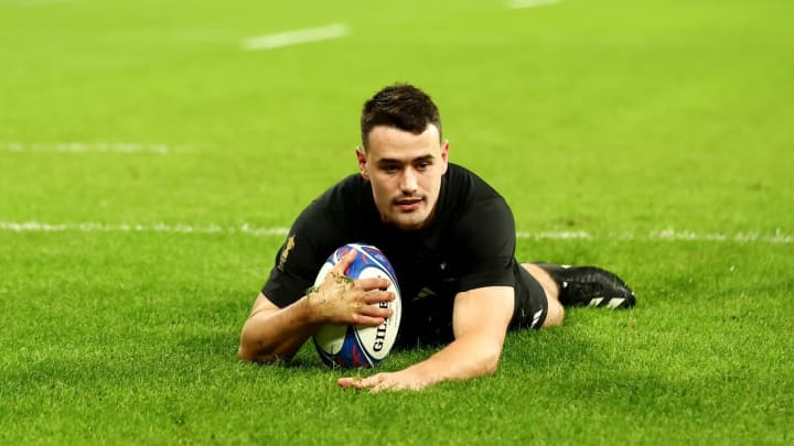 Will Jordan secures a try for the All Blacks, showcasing his skill and determination on the field