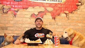 Lee Asher and his pack enjoy a meal at Raising Cane's