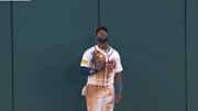 Michael Harris II looks up after catching a high fly ball from Shohei Ohtani.