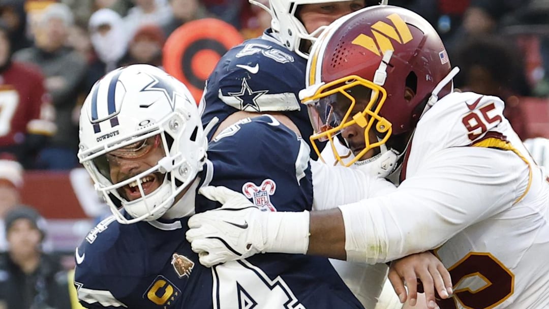 Dallas Cowboys quarterback Dak Prescott is sacked by Washington Commanders defensive tackle Jer'Zhan Newton.