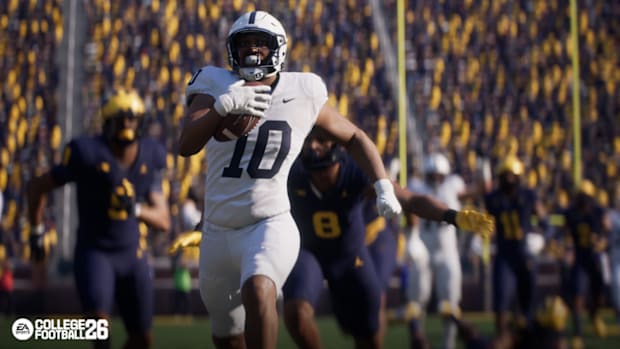 Penn State player rushing the ball vs Michigan in College Football 26