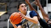 La Lumiere junior Darius Adams looks to put up a shot around teammate Jonas Muya during an open practice Thursday, Nov. 9, 2023, at the La Porte Civic Auditorium.